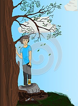 A young boy stands in a tree at the top of the hill