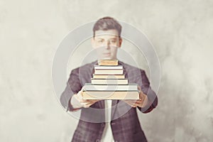 Young boy student with books in glasses. happy guy want learning, have education. online education. Study in school. Male blur.