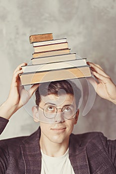 Young boy student with books in glasses. happy guy want learning, have education. online education. Study in school. Male with