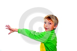 Young boy in studio in green cardigan on white background