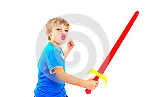 Young boy in studio playing with sword on white background