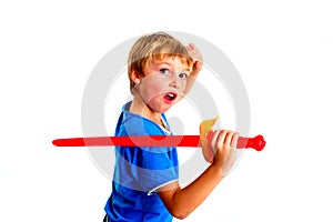 Young boy in studio playing with sword on white background