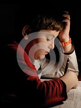 YOUNG BOY STUDYING