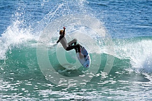 Young Boy Surfing a Wave in California