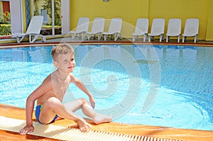 Young boy swimming in the indoor pool