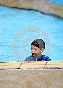 A young boy in a swimming pool
