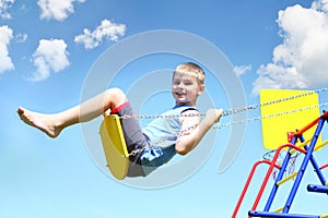 Young boy on swing photo