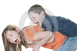 Young boy tackling girl