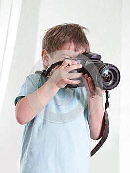 Young boy taking picture