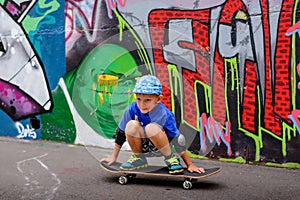 Young boy taking a rest at the skate park