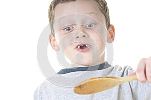 Young boy tasting food