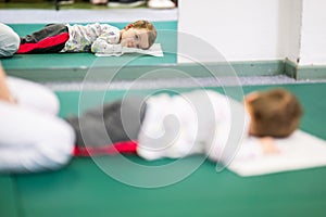 Child on Therapy Mat During SessionYoung boy on a therapy mat during a physiotherapy session, engaging in a supervised