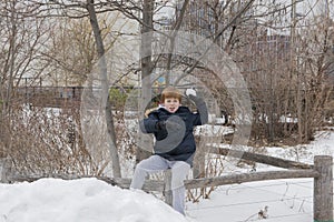 Young boy throwing a snowball