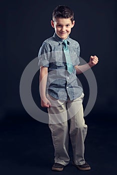 Young Boy In Tie Making Fist