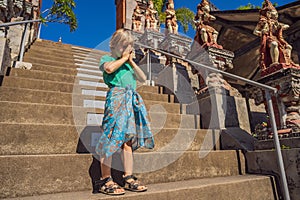 Young boy tourist in budhist temple Brahma Vihara Arama Bali