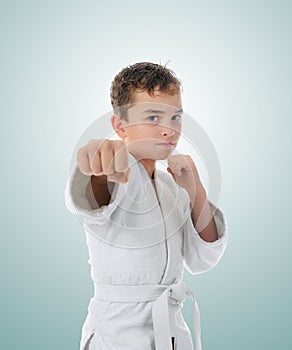 Young boy training karate.