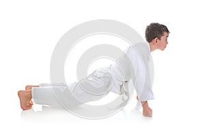 Young boy training karate.
