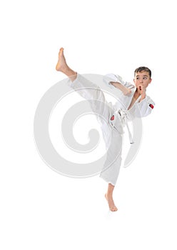 Young boy training karate.