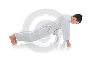 Young boy training karate.