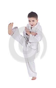 Young boy training kick