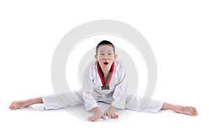 Young boy training taekwondo action isolated