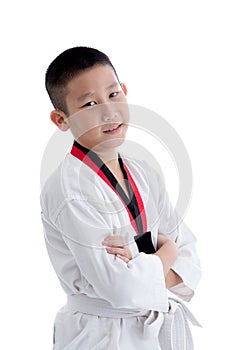 Young boy training taekwondo action isolated