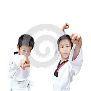 Young boy training taekwondo action isolated