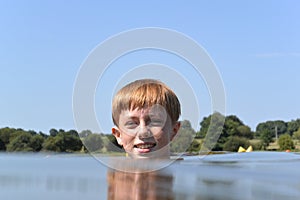Young boy treading water