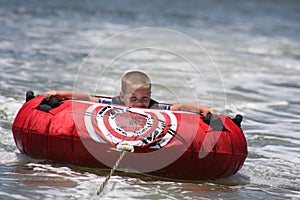 Young boy tubing photo