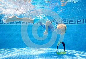 Young boy underwater in swimmi