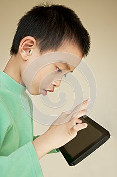 Young boy use to tablet pc