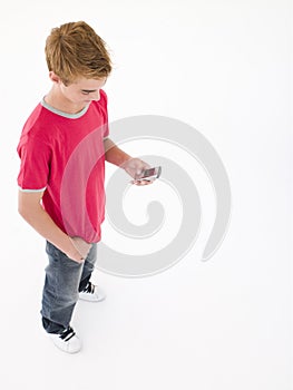 Young boy using cellular phone