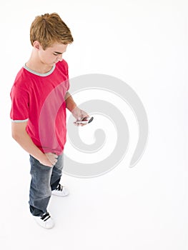 Young boy using cellular phone