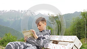 Young boy using digital tablet pc outdoor