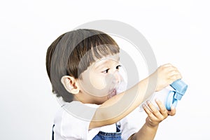 Young Boy Using Inhaler