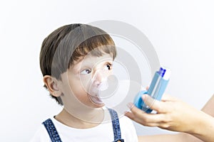 Young Boy Using Inhaler