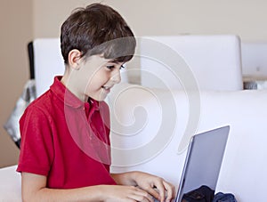 Young Boy Using Laptop Computer