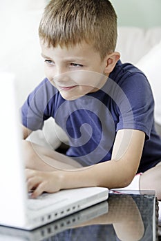 Young boy using a laptop computer