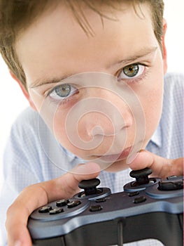 Young boy using videogame controller