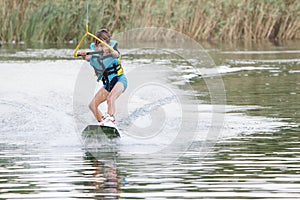 Young boy wakeboarding