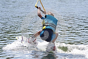 Young boy wakeboarding