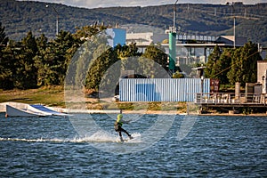 Young boy wakeboarding on a lake