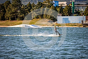 Young boy wakeboarding on a lake
