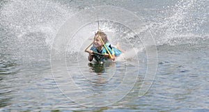 Young boy wakeboarding