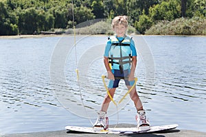 Young boy wakeboarding