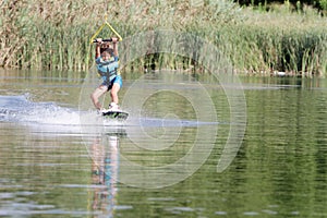 Young boy wakeboarding