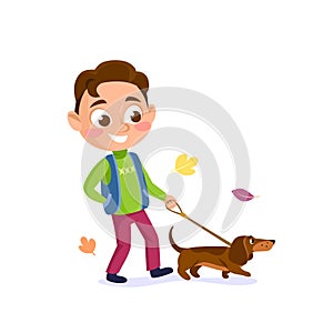 A young boy walks the dog on a leash in the fall, isolated on white background