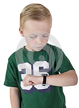 Young boy watching the time on his wristwatch