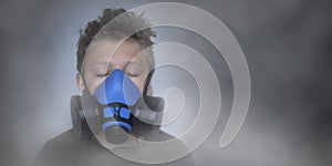 Young boy wearing gasmask, respirator portrait