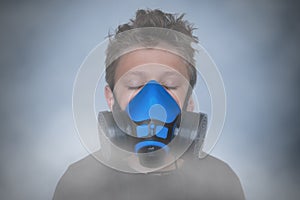 Young boy wearing gasmask, respirator portrait